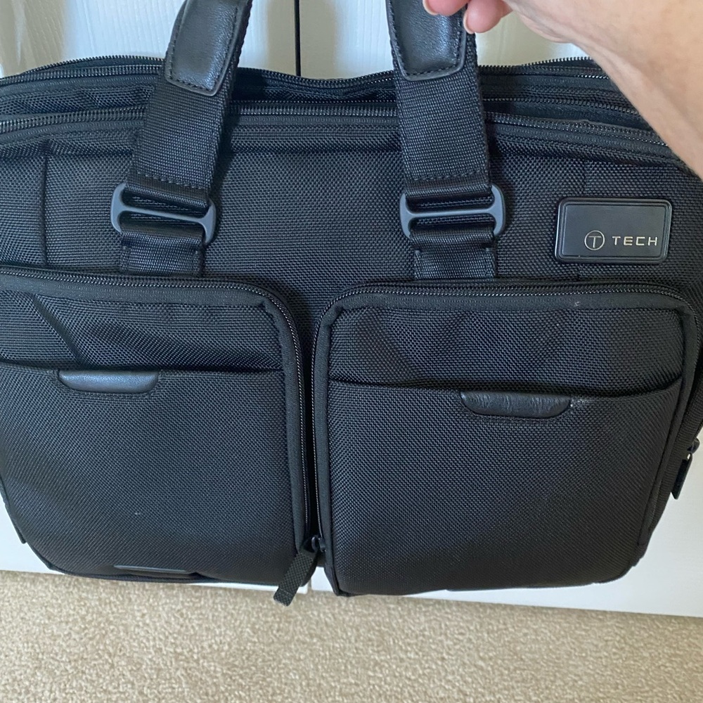 Tumi work bag. Holds any size laptop.  Used once. Like brand new